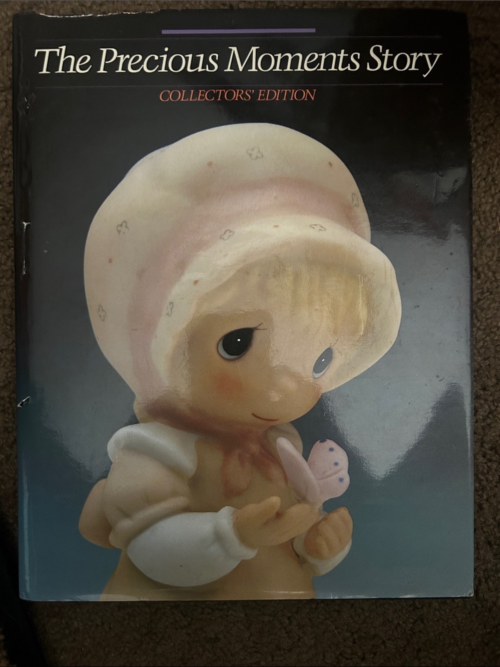 Precious Moments Book Cover Featuring Pink and Cream Figurine